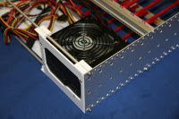 PC power supply mounted to back plate